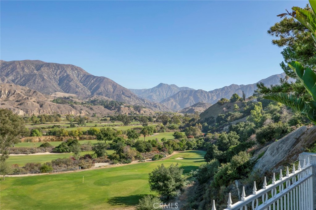 9071 Riderwood Drive Sunland, CA 91040 - Photo 25 of 46 a view of a lush green field with mountains in the background