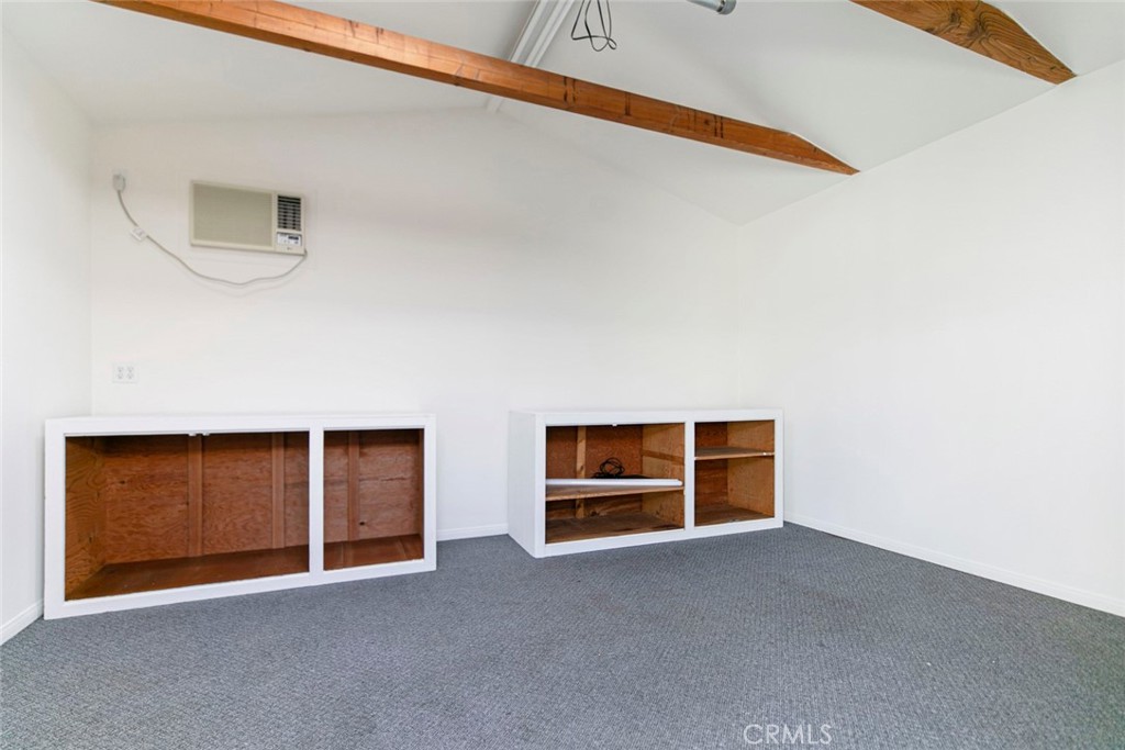 9071 Riderwood Drive Sunland, CA 91040 - Photo 34 of 46 a view of an empty room with wooden floor and windows