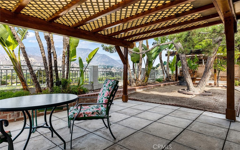 9071 Riderwood Drive Sunland, CA 91040 - Photo 38 of 46 a view of a patio with a table chairs and backyard