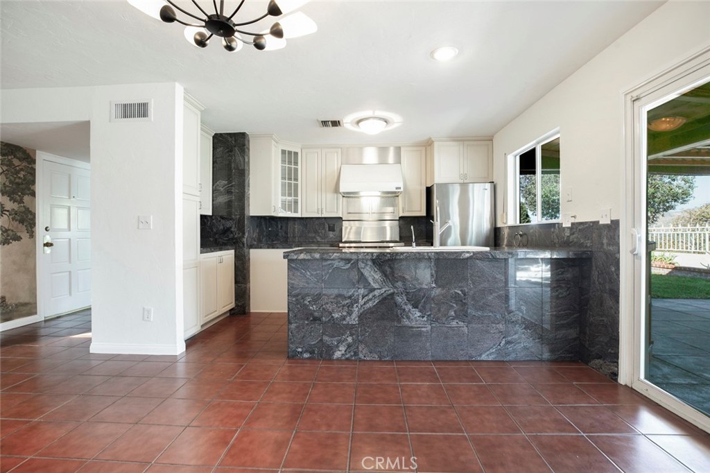9071 Riderwood Drive Sunland, CA 91040 - Photo 7 of 46 a large bathroom with a granite countertop sink a large mirror and shower
