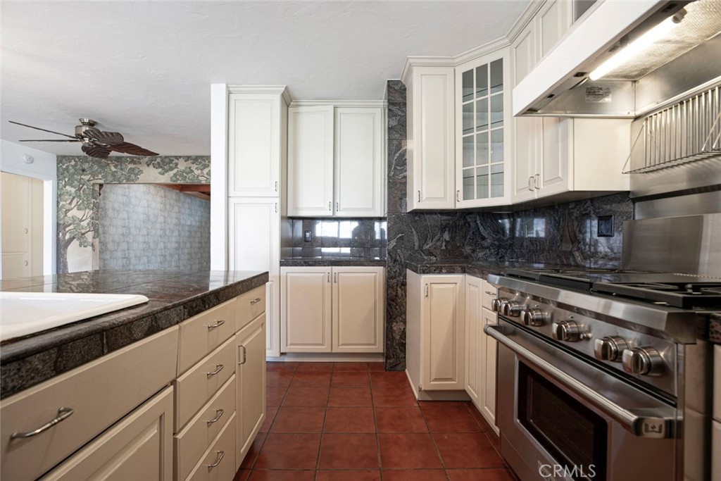 9071 Riderwood Drive Sunland, CA 91040 - Photo 10 of 46 a kitchen with cabinets appliances and a window