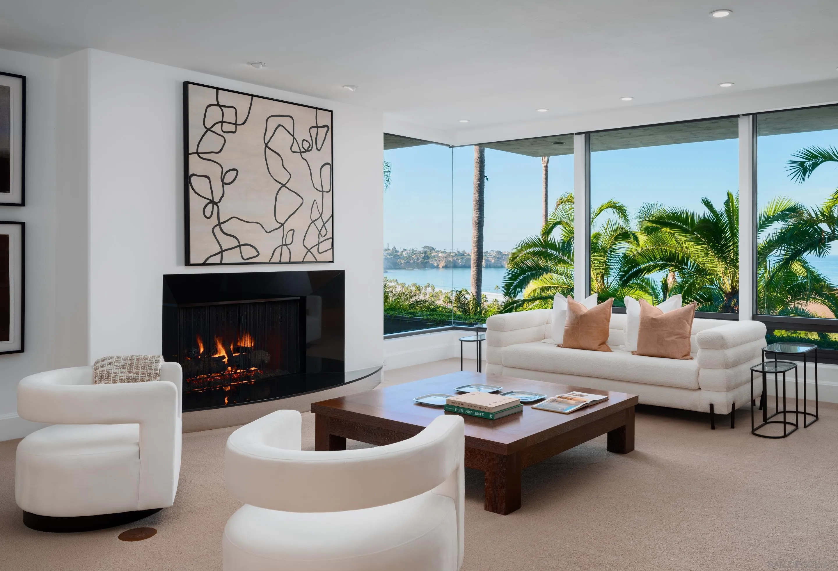 8633 Ruette Monte Carlo La Jolla, CA 92037 - Photo 11 of 48 a living room with furniture potted plant and a fireplace