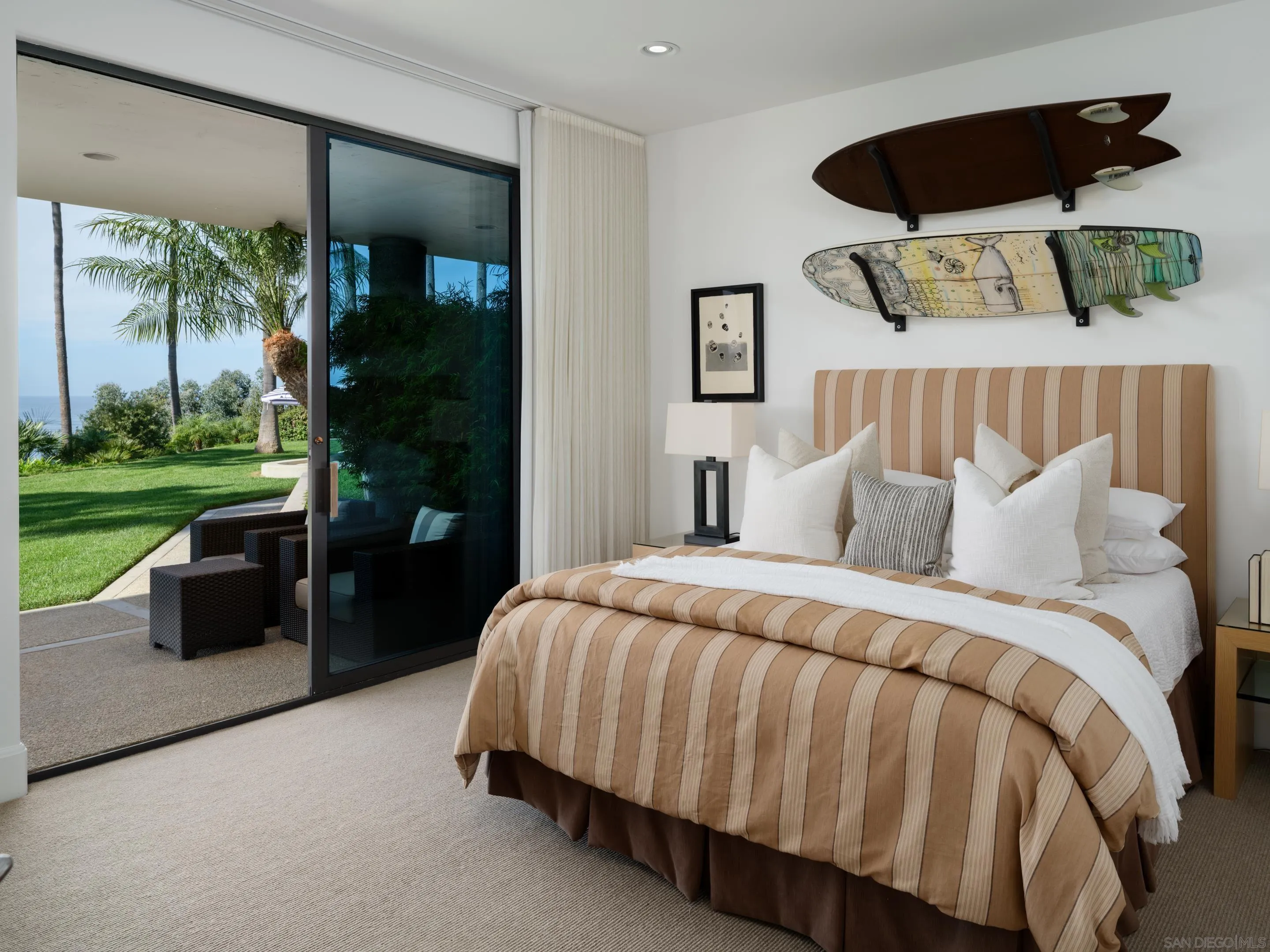 8633 Ruette Monte Carlo La Jolla, CA 92037 - Photo 40 of 48 a bedroom with a bed and a large window