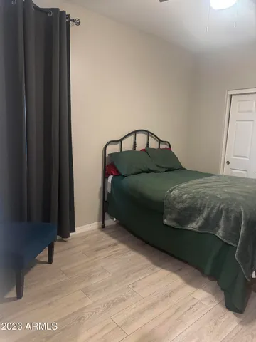 a bedroom with a bed and a closet