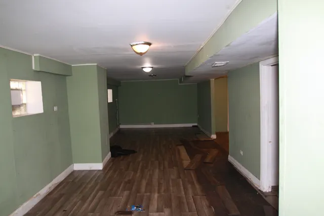 a view of gallery with wooden floor