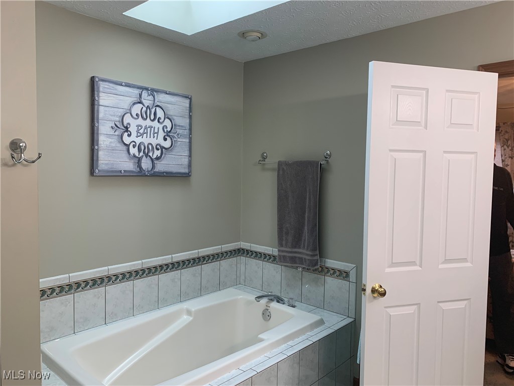 9046 Shepard Road Macedonia, OH 44056 - Photo 21 of 33 Owners bath with a skylight over the soaking tub.