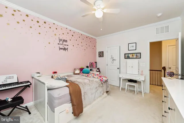 a bedroom that has a bed and a table in it