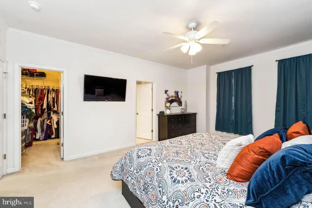 a bed room with a bed and a television