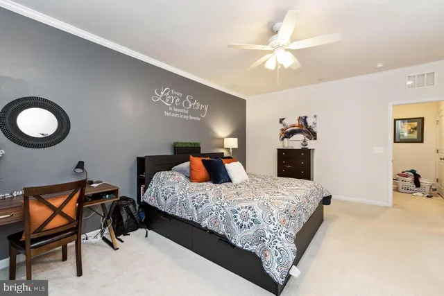 a bedroom with a bed and dresser