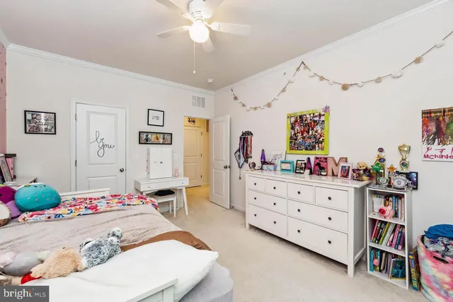 a bed room with a bed and a dresser