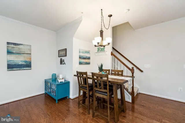a view of a livingroom with furniture and wooden floor