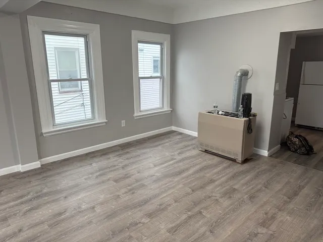 a room with a bed and a window