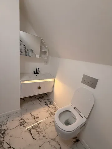 a bathroom with a sink a toilet and a bathtub
