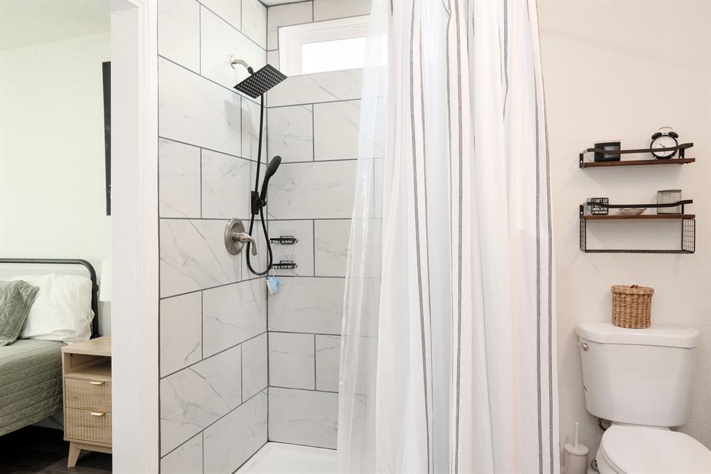 205 Oregon Avenue Azle, TX 76020 - Photo 21 of 40 Ensuite bathroom featuring a shower stall