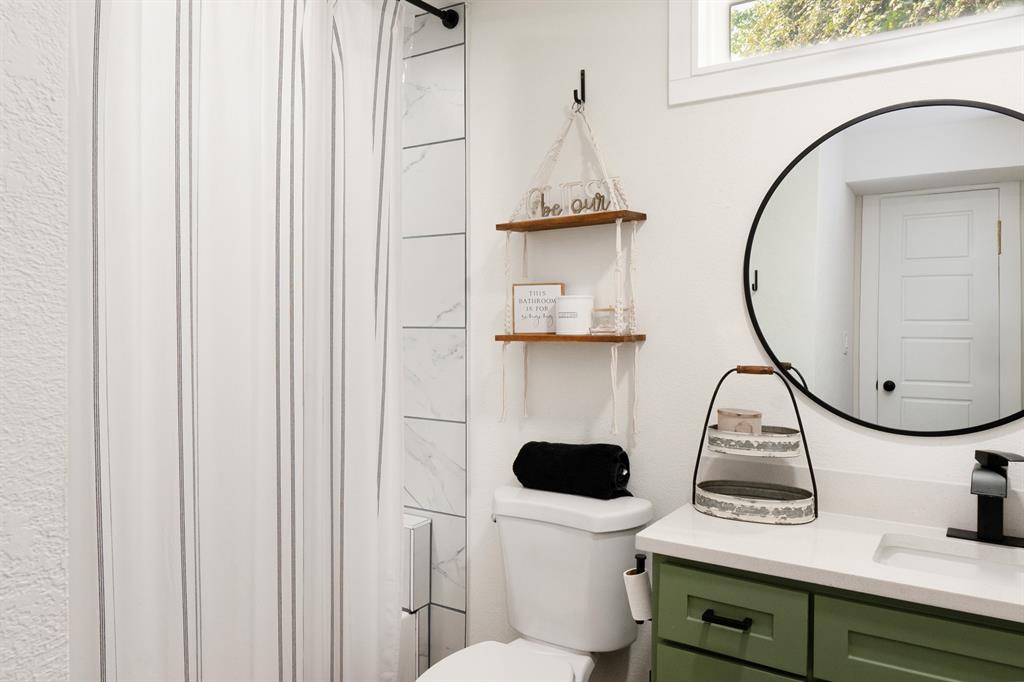 205 Oregon Avenue Azle, TX 76020 - Photo 25 of 40 Full bathroom featuring vanity and a shower with curtain