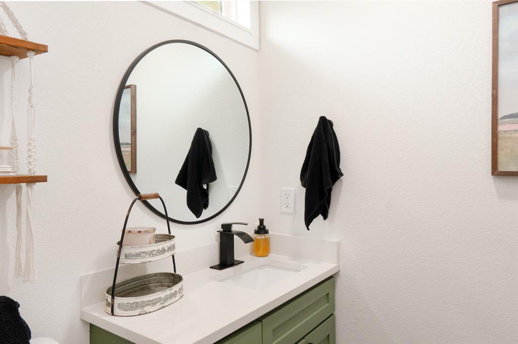 205 Oregon Avenue Azle, TX 76020 - Photo 26 of 40 Full bath with vanity and a textured wall