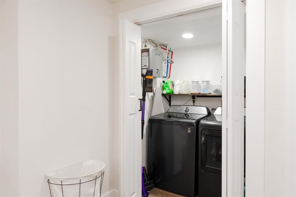 205 Oregon Avenue Azle, TX 76020 - Photo 29 of 40 Laundry area with separate washer and dryer and tankless water heater