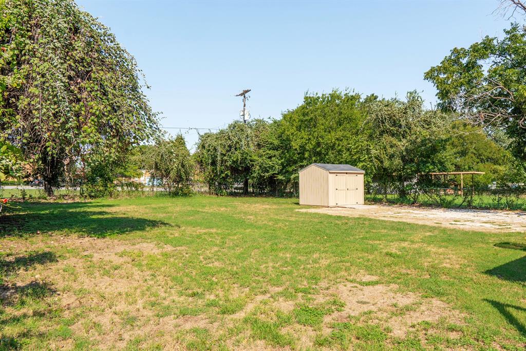 205 Oregon Avenue Azle, TX 76020 - Photo 36 of 40 View of yard featuring a shed