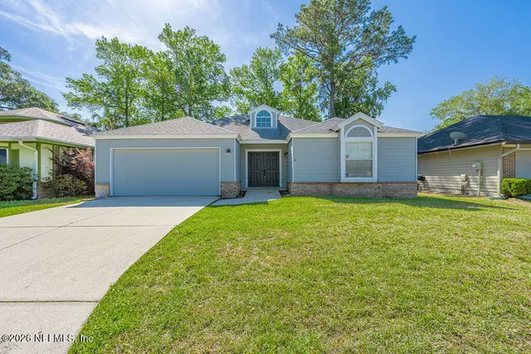 front view of a house with a yard