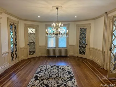 a view of a room with window and wooden floor