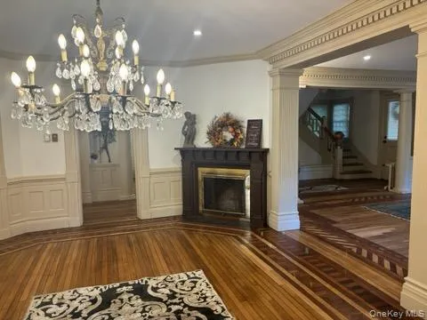 a room with fireplace and chandelier