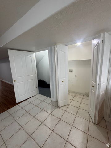1976 River Bottom Road Springville, UT 84663 - Photo 35 of 45 Utility area featuring square tile flooring and white paneled doors