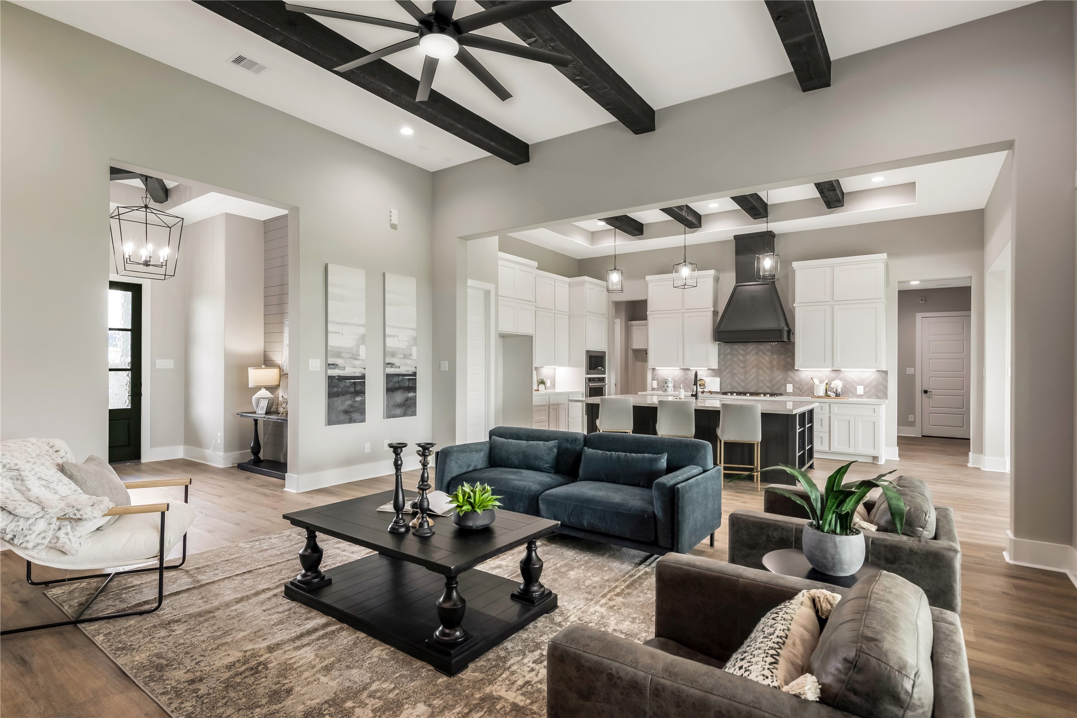 1483 Bluebonnet Ridge Drive Chappell Hill, TX 77426 - Photo 15 of 44 a living room with furniture kitchen view and a chandelier