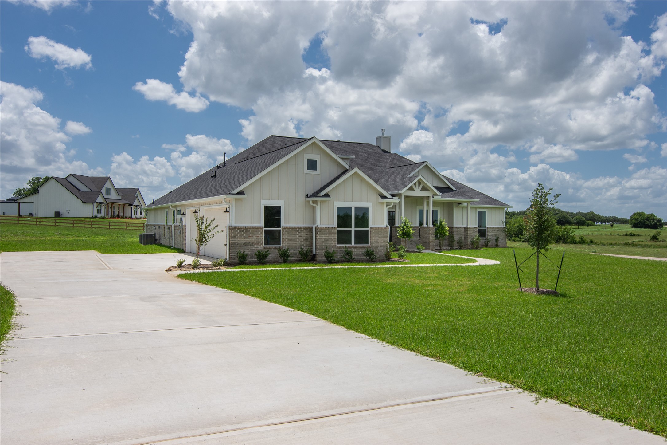 1483 Bluebonnet Ridge Drive Chappell Hill, TX 77426 - Photo 2 of 44 a front view of house with yard and green space