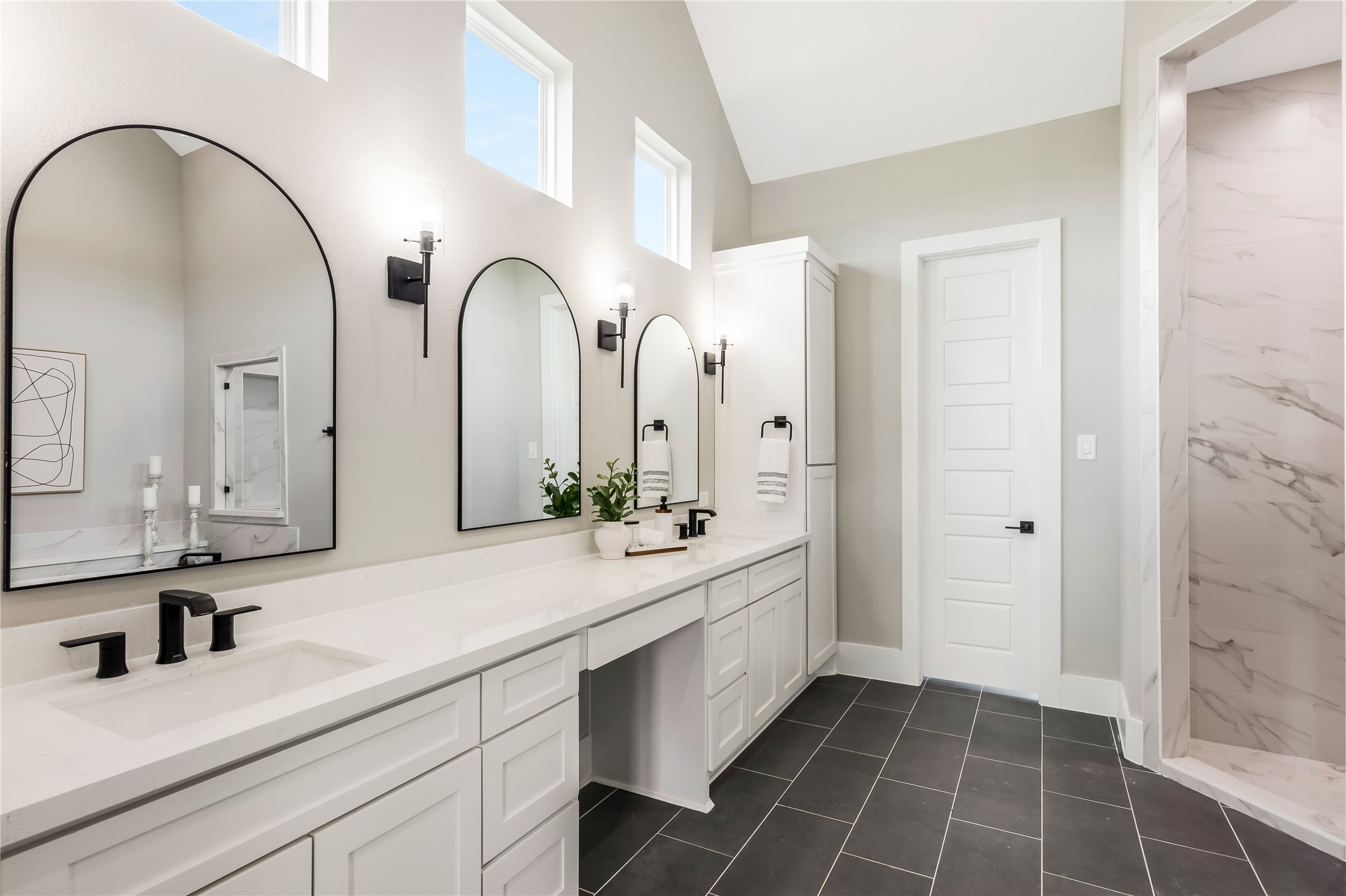 1483 Bluebonnet Ridge Drive Chappell Hill, TX 77426 - Photo 28 of 44 a bathroom with a double vanity sink and a mirror