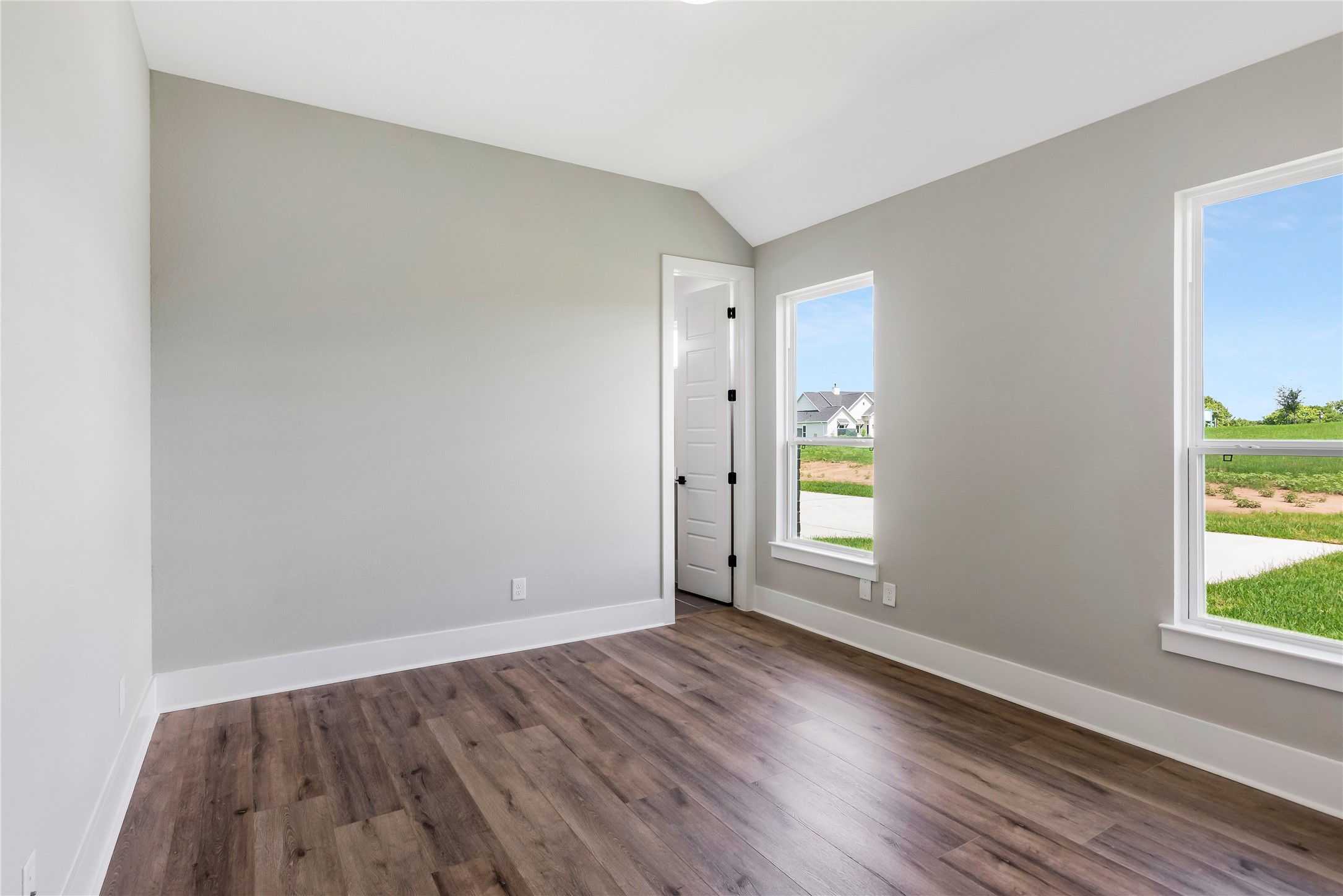 1483 Bluebonnet Ridge Drive Chappell Hill, TX 77426 - Photo 35 of 44 an empty room with wooden floor and windows