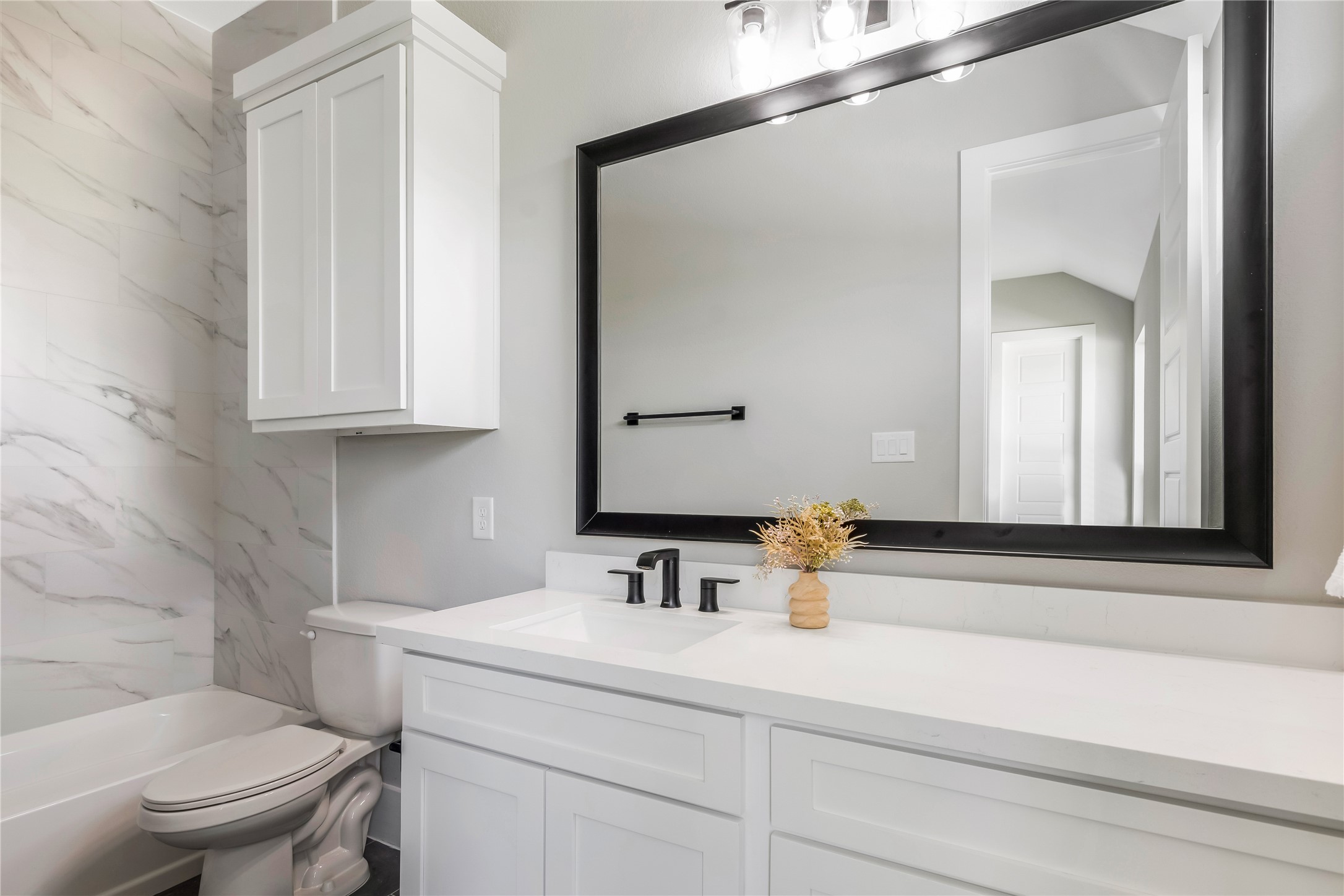 1483 Bluebonnet Ridge Drive Chappell Hill, TX 77426 - Photo 36 of 44 a bathroom with a sink and a toilet
