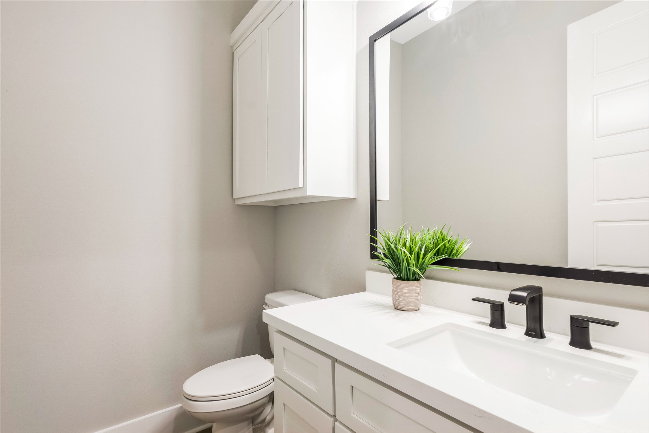 1483 Bluebonnet Ridge Drive Chappell Hill, TX 77426 - Photo 39 of 44 a bathroom with a sink a mirror and toilet