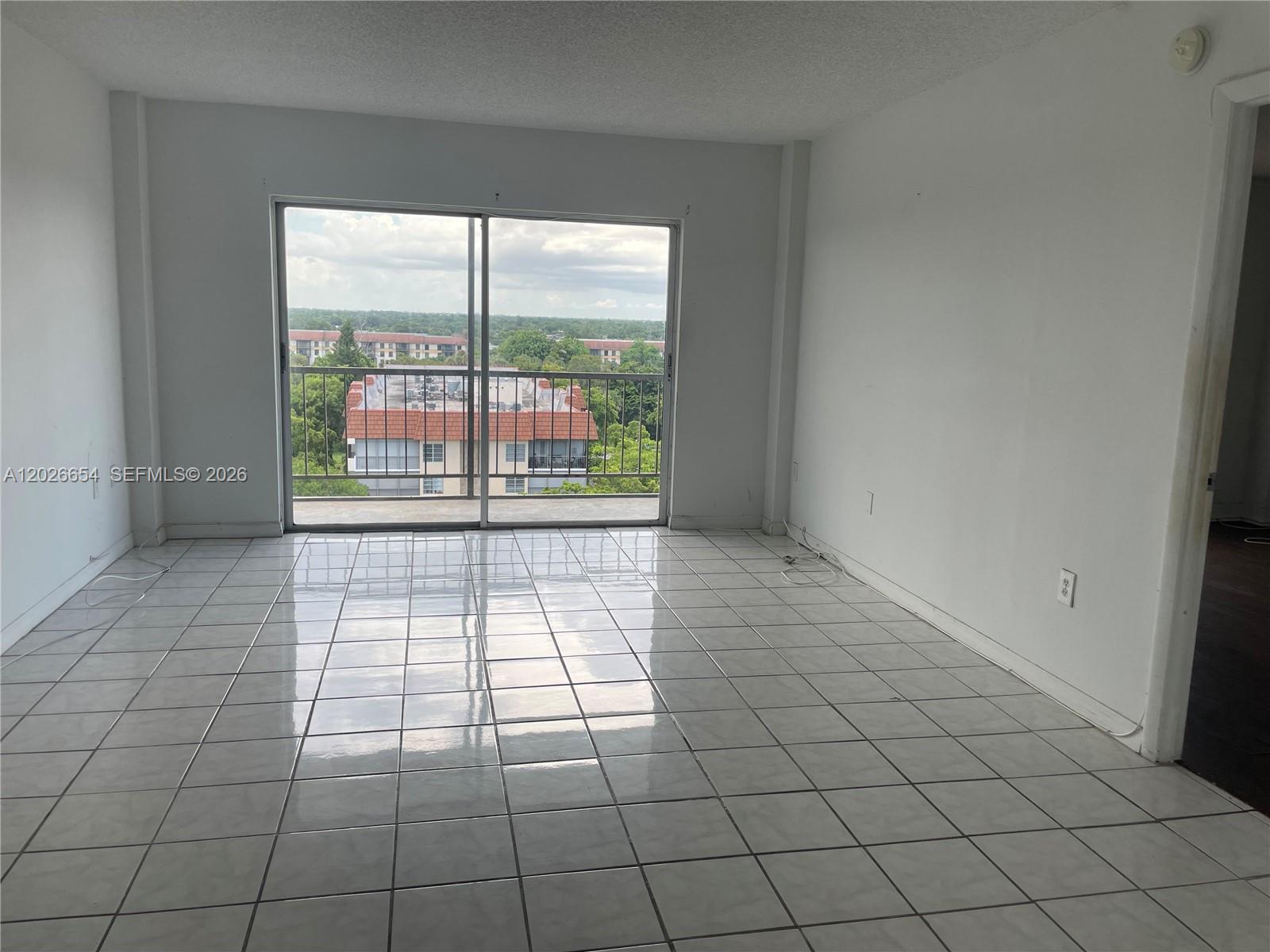 4174 Inverrary Drive, Unit 903 Lauderhill, FL 33319 - Photo 11 of 36 a view of empty room with windows