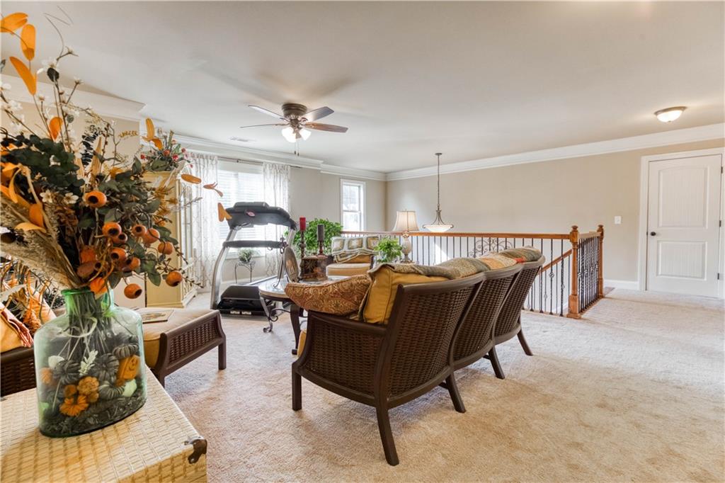 1461 Bradford Lane Monroe, GA 30656 - Photo 36 of 66 a living room with furniture and a potted plant