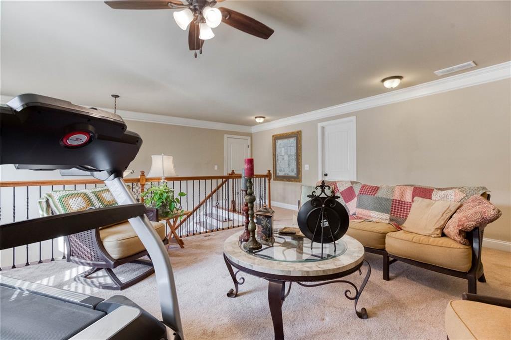 1461 Bradford Lane Monroe, GA 30656 - Photo 37 of 66 a living room with furniture and wooden floor