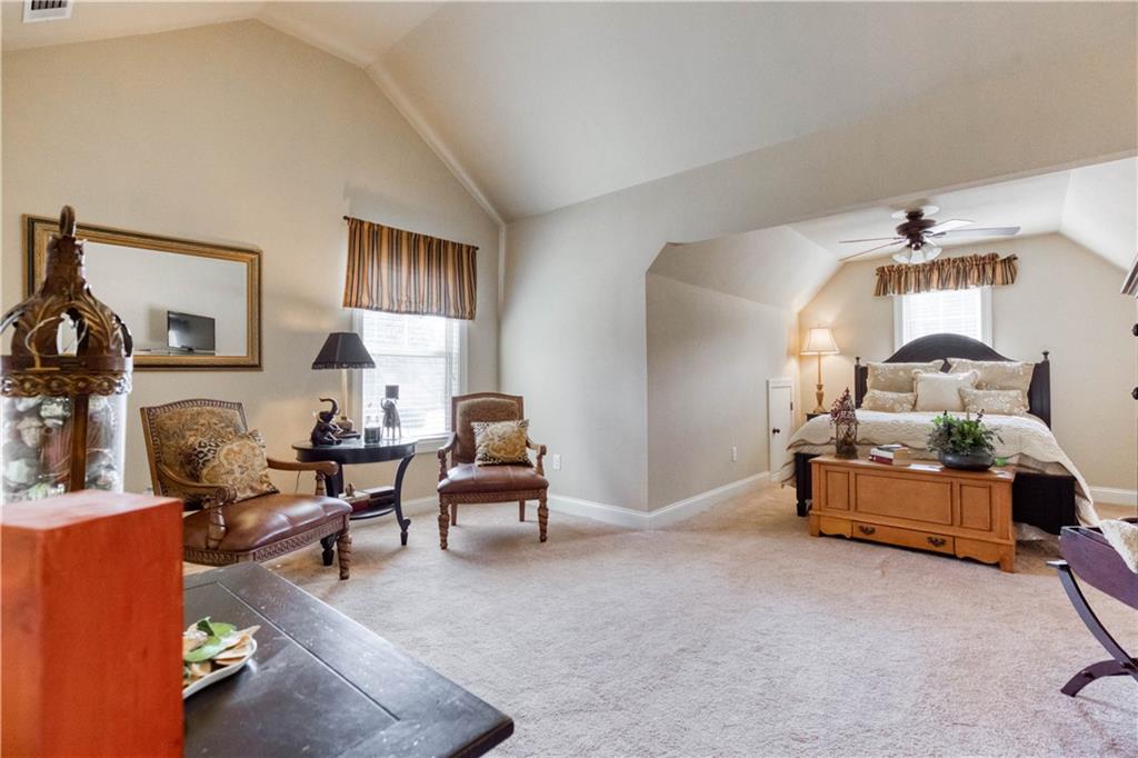 1461 Bradford Lane Monroe, GA 30656 - Photo 38 of 66 a living room with furniture and a lamp