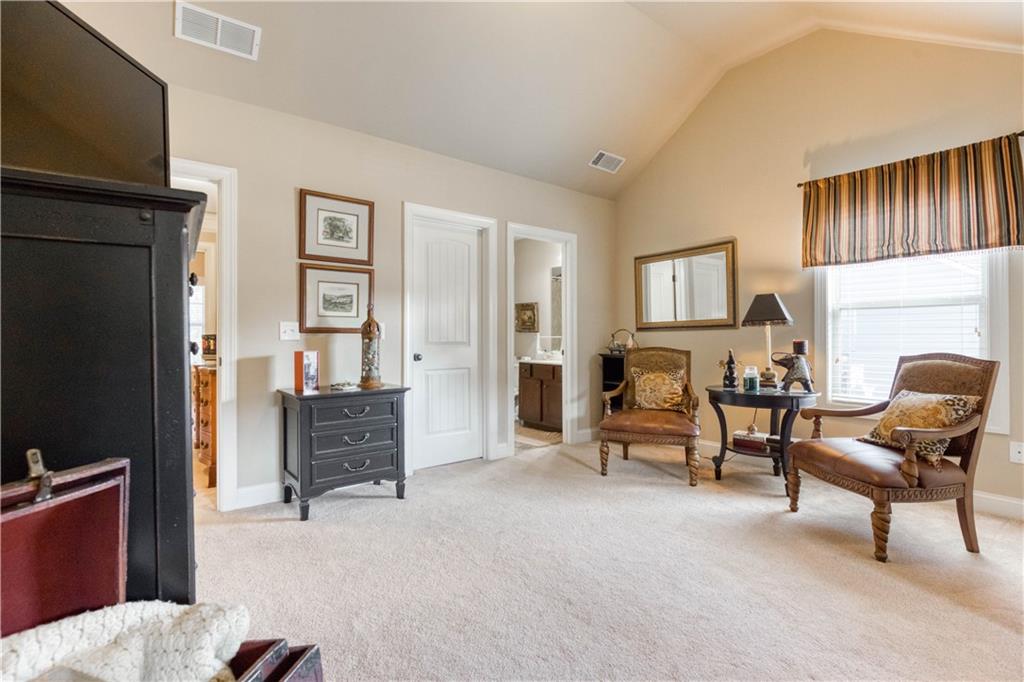 1461 Bradford Lane Monroe, GA 30656 - Photo 41 of 66 a bedroom with furniture and a flat screen tv