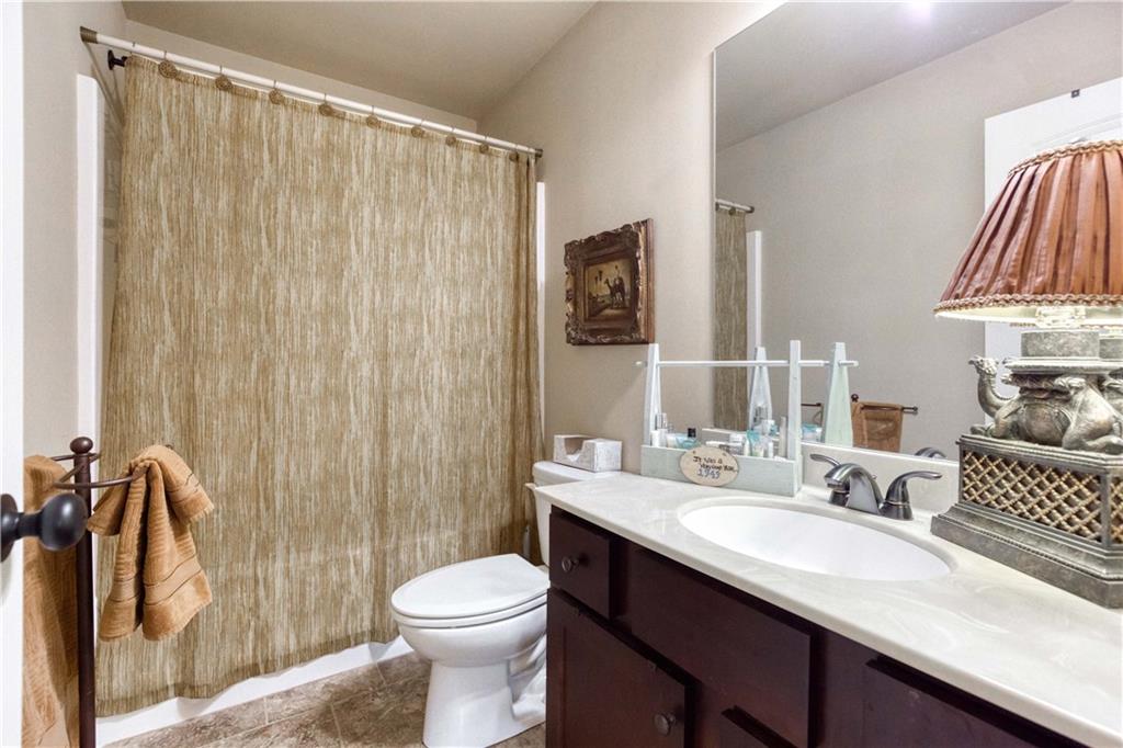 1461 Bradford Lane Monroe, GA 30656 - Photo 42 of 66 a bathroom with a sink a toilet and shower