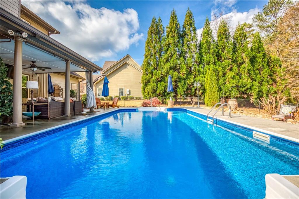 1461 Bradford Lane Monroe, GA 30656 - Photo 51 of 66 a view of swimming pool with seating area