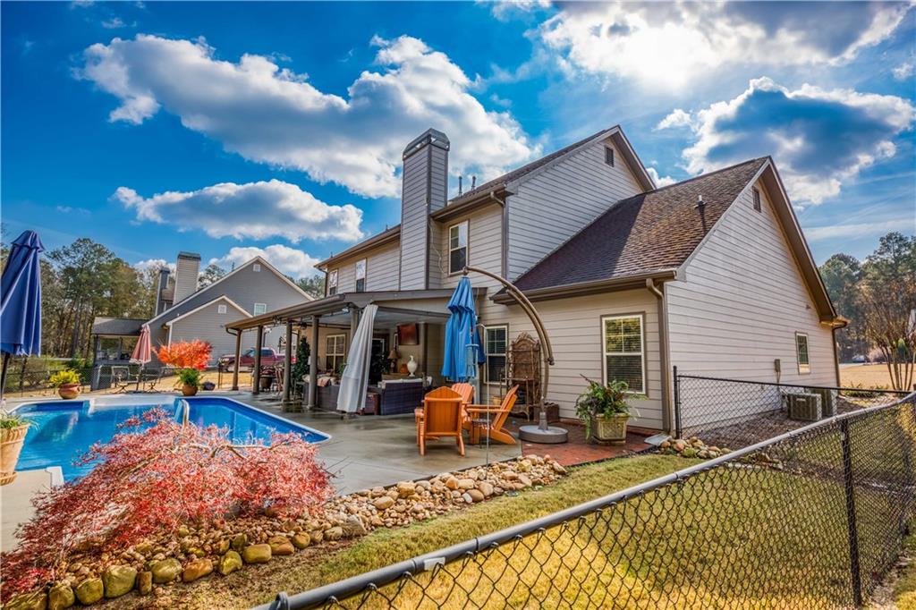 1461 Bradford Lane Monroe, GA 30656 - Photo 57 of 66 a view of a house with basketball court