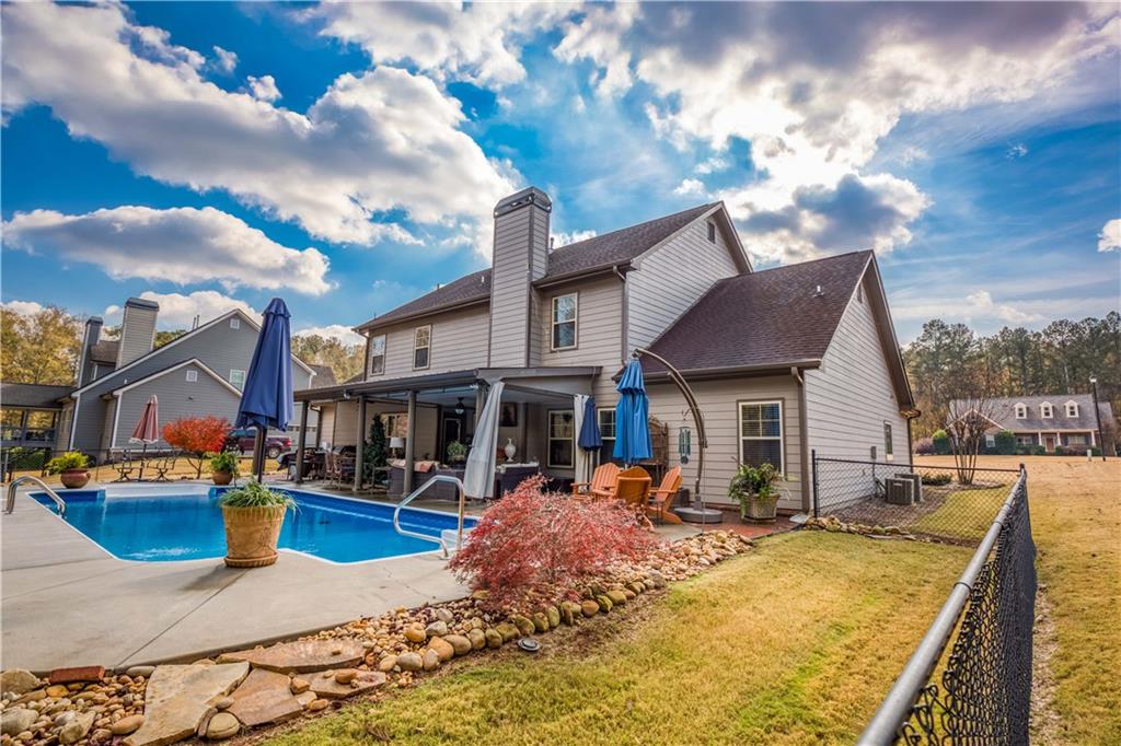 1461 Bradford Lane Monroe, GA 30656 - Photo 58 of 66 a view of a house with swimming pool