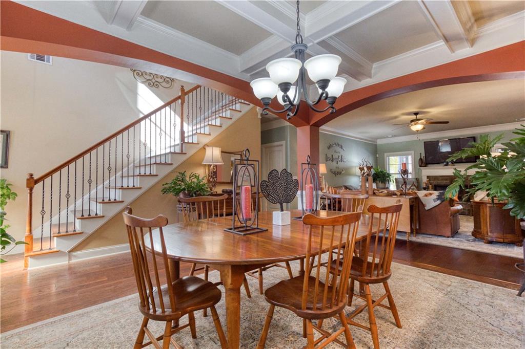 1461 Bradford Lane Monroe, GA 30656 - Photo 9 of 66 a view of a dining room with furniture wooden floor and chandelier
