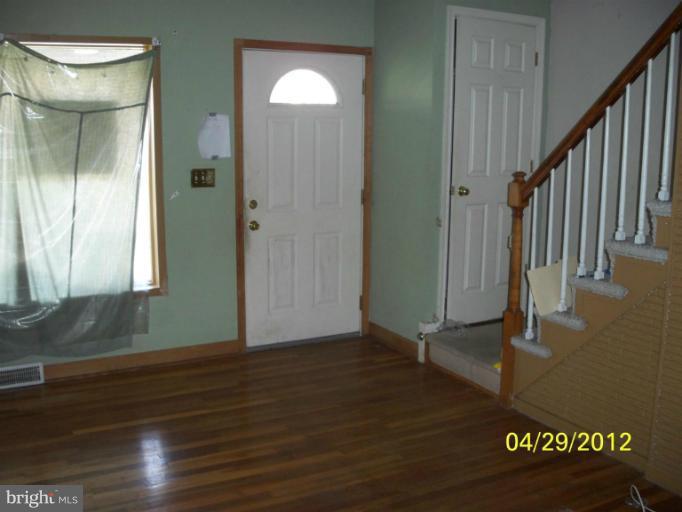 8052 Kimberly Road Dundalk, MD 21222 - Photo 3 of 6 a view of front door with wooden floor