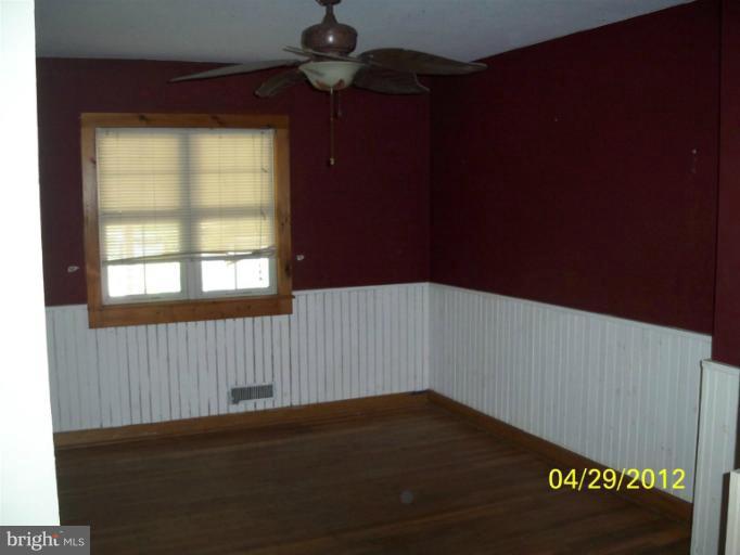 8052 Kimberly Road Dundalk, MD 21222 - Photo 4 of 6 a view of an empty room with a window