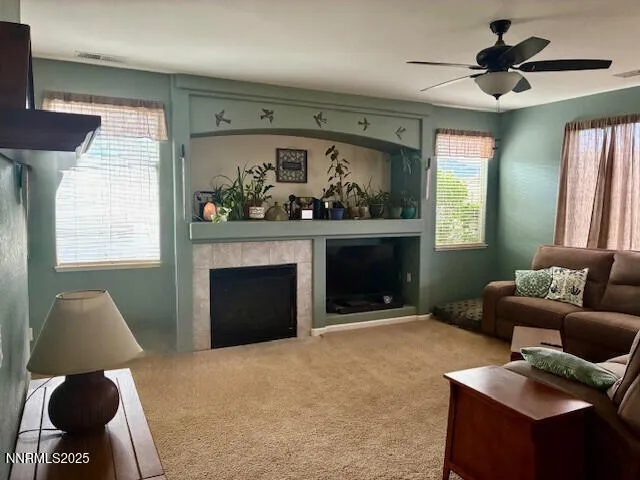 a living room with furniture and a fireplace