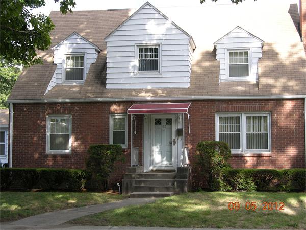 167 Redlands Street Springfield, MA 01104 - Photo 2 of 21 a front view of a house with garden