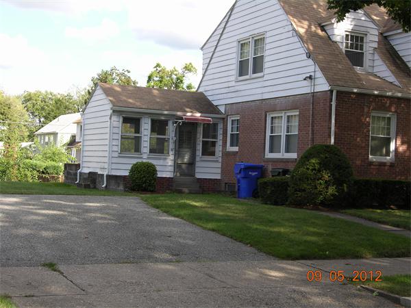 167 Redlands Street Springfield, MA 01104 - Photo 4 of 21 a view of a house with a yard