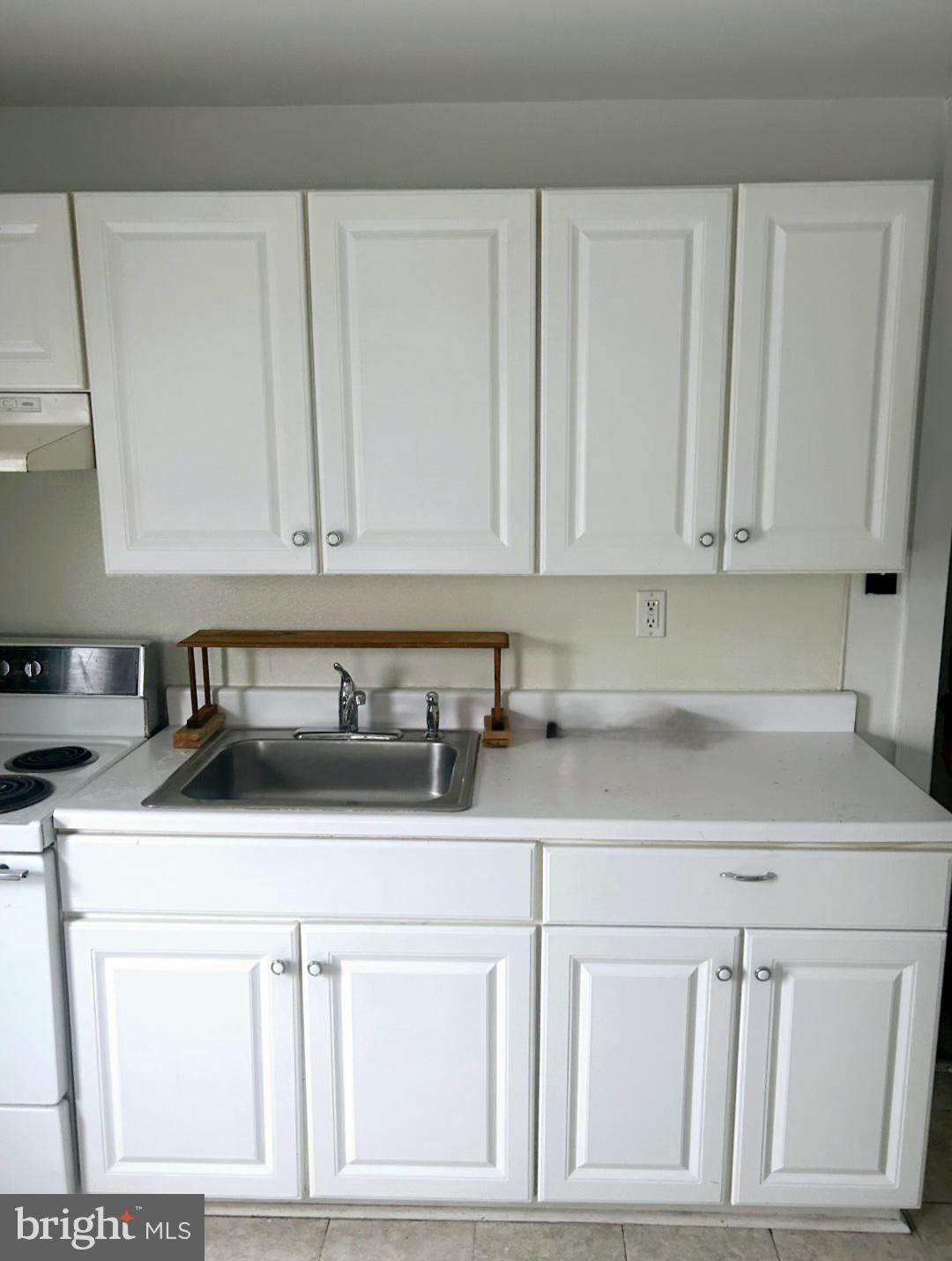 213-219 North Delsea Drive, Unit 17B Clayton, NJ 08312 - Photo 1 of 4 a kitchen with white cabinets