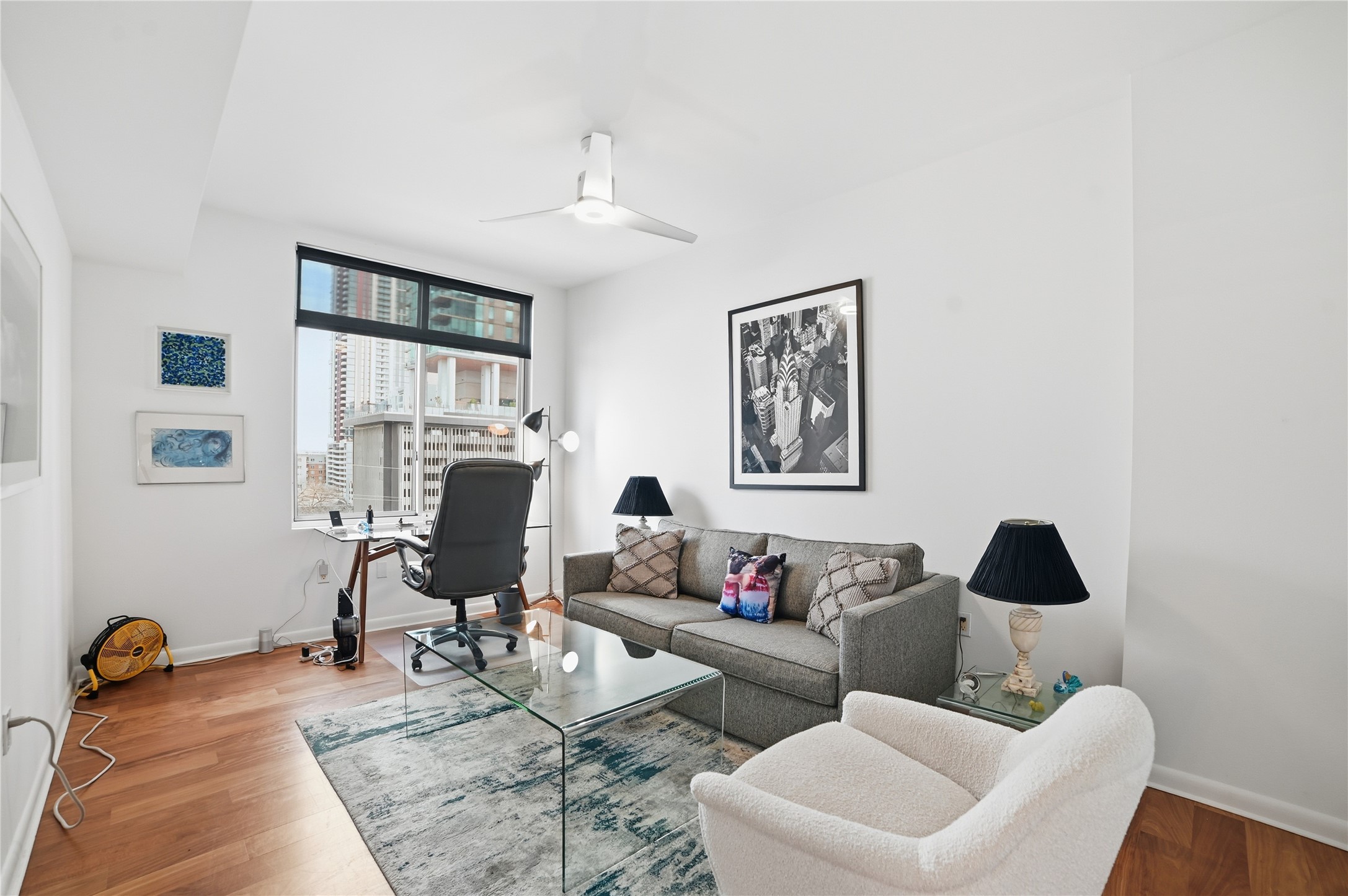 54 Rainey Street, Unit 1018 Austin, TX 78701 - Photo 21 of 32 a living room with furniture or couch and a window