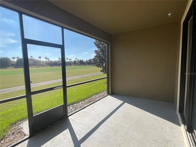 a view of an empty room with a large window